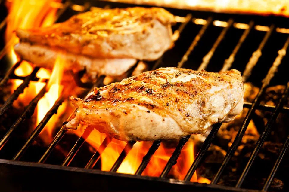 Miss Essie’s fire-kissed chicken served in a clean, appetizing presentation that fits a Salt Lake City tailgate spread.
