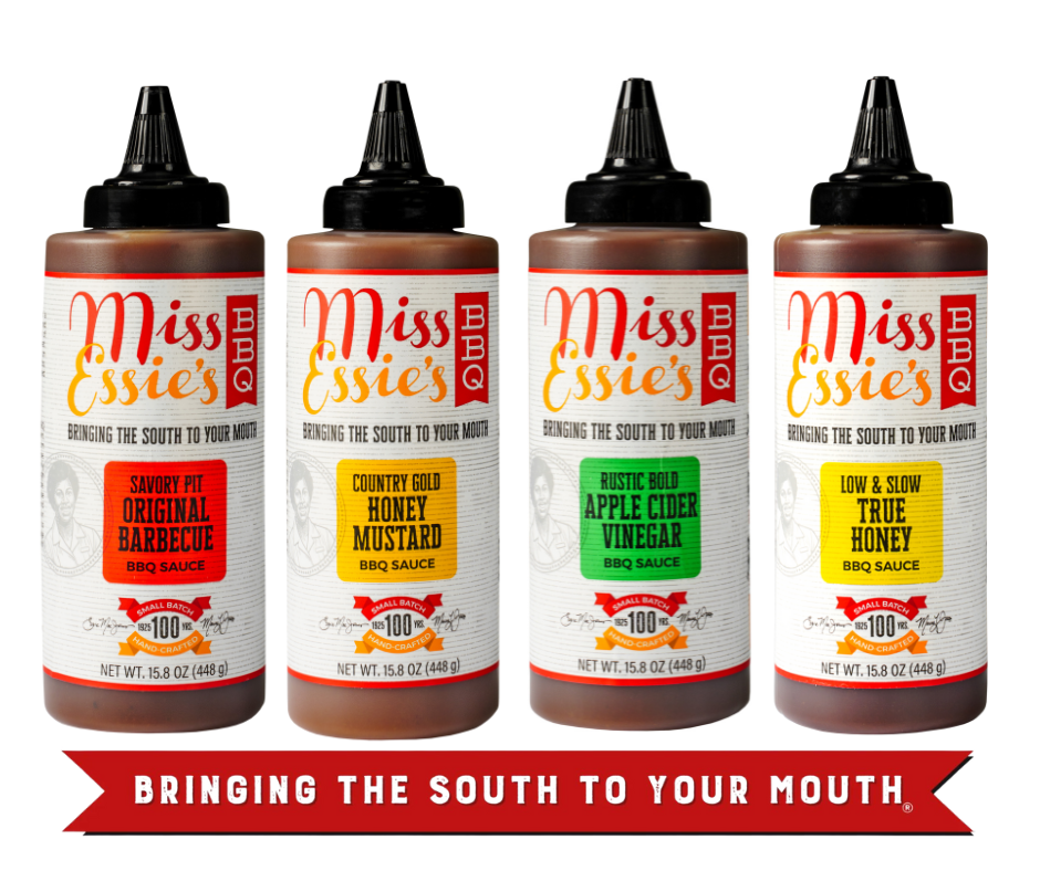 Four bottles of Miss Ellie's sauces with labels for different flavors on a white background.